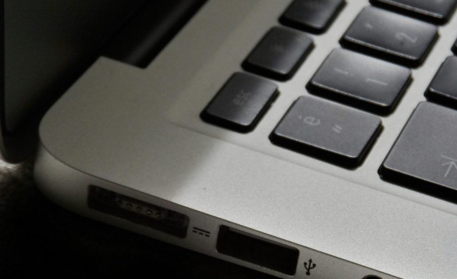 Free Detailed view of a silver laptop showing keyboard and multiple ports. Stock Photo
